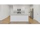 Modern kitchen with white cabinets and granite countertops at 219 Marauder Dr., Longs, SC 29568