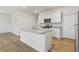 Modern kitchen with white cabinets, granite countertops, and stainless steel appliances at 219 Marauder Dr., Longs, SC 29568