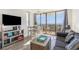 Living room with ocean view, comfortable seating, and game shelf at 2310 North Ocean Blvd. # 201, Myrtle Beach, SC 29577
