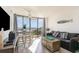 Oceanfront living room with comfy seating and access to balcony at 2310 North Ocean Blvd. # 201, Myrtle Beach, SC 29577