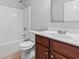 Clean bathroom with a tub, toilet and wood vanity at 2379 Morlynn Dr., Myrtle Beach, SC 29577