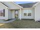 Gray house with a black door and shutters, and a small yard at 2379 Morlynn Dr., Myrtle Beach, SC 29577