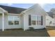 Gray siding house with black shutters, and a small front yard at 2379 Morlynn Dr., Myrtle Beach, SC 29577