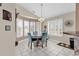 Bright breakfast nook with a table and four chairs, surrounded by windows at 238 Cold Water Circle, Myrtle Beach, SC 29588