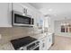 Modern kitchen with white cabinets, granite countertops, and stainless steel appliances at 2483 Morlynn Dr., Myrtle Beach, SC 29577