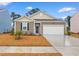 Charming one-story home with a two-car garage and well-manicured lawn at 2613 Pegasus Place, Myrtle Beach, SC 29577