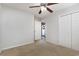 Bedroom with ceiling fan, carpet, double door closet and access to back patio at 295 Four Leaf Ln., Murrells Inlet, SC 29576