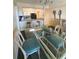 Bright dining area with glass table and wicker chairs at 3217 S Ocean Blvd. S, North Myrtle Beach, SC 29582