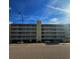 Building exterior of Windy Shores II, featuring parking and signage at 3217 S Ocean Blvd. S, North Myrtle Beach, SC 29582