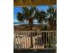Beachfront balcony view with palm trees and patio furniture at 3217 S Ocean Blvd. S, North Myrtle Beach, SC 29582