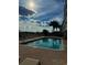 Community pool with lounge chairs and palm trees at 3217 S Ocean Blvd. S, North Myrtle Beach, SC 29582