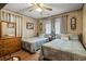 Guest bedroom with two twin beds, dresser and wood floors at 327 55Th Ave. N, North Myrtle Beach, SC 29582
