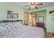 Comfortable main bedroom with a ceiling fan and en-suite bathroom at 327 55Th Ave. N, North Myrtle Beach, SC 29582