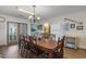 Bright dining room with large table and access to deck at 327 55Th Ave. N, North Myrtle Beach, SC 29582