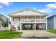 Charming beach house featuring an elevated design and a large deck at 327 55Th Ave. N, North Myrtle Beach, SC 29582