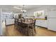 Kitchen with white cabinets, dining table and access to deck at 327 55Th Ave. N, North Myrtle Beach, SC 29582