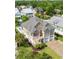 Aerial view of a two-story home with a well-manicured lawn, two-car garage, and a private backyard pool at 352 Sea Marsh Rd., Murrells Inlet, SC 29576