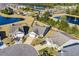 Panoramic aerial view shows the neighborhood featuring mature trees, a large pond, and community amenities at 3716 Mackevans Ct., Myrtle Beach, SC 29579