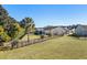 Spacious backyard with lush grass, a fenced perimeter, and a view of the home's exterior at 3716 Mackevans Ct., Myrtle Beach, SC 29579