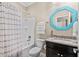 Cozy bathroom with a shower-tub combo, a decorative mirror, and stylish fixtures and accessories at 3716 Mackevans Ct., Myrtle Beach, SC 29579