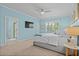 Bright and airy bedroom featuring neutral carpet, light blue walls, and ample natural light at 3716 Mackevans Ct., Myrtle Beach, SC 29579