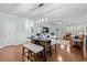 Open dining and living area with hardwood floors, modern lighting, and comfortable seating at 3716 Mackevans Ct., Myrtle Beach, SC 29579