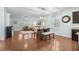 Open dining and living area with hardwood floors, modern lighting, and comfortable seating at 3716 Mackevans Ct., Myrtle Beach, SC 29579