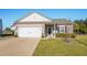 Charming single-story home with a well-manicured lawn, two car garage and inviting entrance at 3716 Mackevans Ct., Myrtle Beach, SC 29579