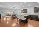 Bright, open kitchen features a granite island with seating, dark cabinetry, and stainless appliances at 3716 Mackevans Ct., Myrtle Beach, SC 29579