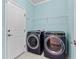 A laundry room featuring a side-by-side washer and dryer set and a door at 3716 Mackevans Ct., Myrtle Beach, SC 29579