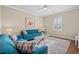 Bright living room with hardwood floors, a blue sofa, and a glass-top coffee table at 3716 Mackevans Ct., Myrtle Beach, SC 29579