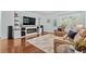 The bright living room has built in shelves, an electric fireplace, and a door to the outside at 3716 Mackevans Ct., Myrtle Beach, SC 29579