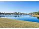 Picturesque view of a calm pond surrounded by well-maintained homes in a residential community at 3716 Mackevans Ct., Myrtle Beach, SC 29579