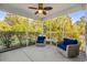 Cozy screened-in porch with comfortable chairs and a view of the lush backyard at 3716 Mackevans Ct., Myrtle Beach, SC 29579