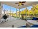 Screened-in porch overlooking the backyard, featuring comfortable seating and a grill at 3716 Mackevans Ct., Myrtle Beach, SC 29579