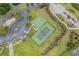 Aerial view of community tennis and basketball courts with ample parking and landscaping at 3716 Mackevans Ct., Myrtle Beach, SC 29579
