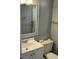 Bathroom with white vanity, toilet and a framed mirror at 4111 S Ocean Blvd. # 701, North Myrtle Beach, SC 29582