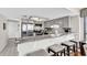 Bright kitchen with stainless steel appliances, granite countertops, and breakfast bar seating at 4111 S Ocean Blvd. # 701, North Myrtle Beach, SC 29582