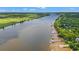 Aerial view of the Waccamaw River lined with docks and lush greenery at 42 Mud Minnow Dr., Pawleys Island, SC 29585