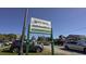 Welcome to the Murrells Inlet Marsh Walk sign surrounded by cars and local businesses at 42 Mud Minnow Dr., Pawleys Island, SC 29585