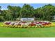Pawleys Plantation Golf and Country Club entrance sign with beautiful flowerbed and landscaping at 42 Mud Minnow Dr., Pawleys Island, SC 29585