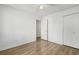 Bright bedroom featuring wood-look floors and an adjacent bathroom at 448 Red River Ct. # 39H, Myrtle Beach, SC 29579