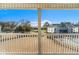 View from balcony overlooks pool, community, and landscaping at 448 Red River Ct. # 39H, Myrtle Beach, SC 29579