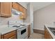 Bright kitchen features wood cabinets and an electric range at 448 Red River Ct. # 39H, Myrtle Beach, SC 29579