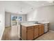 Simple kitchen with light wood cabinets and access to a balcony at 448 Red River Ct. # 39H, Myrtle Beach, SC 29579