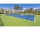 Blue tennis court with green surrounding at 448 Red River Ct. # 39H, Myrtle Beach, SC 29579