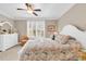 Bright main bedroom features a ceiling fan, shutters and coastal design at 48 Mingo Dr. # 1-C, Pawleys Island, SC 29585