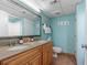 Bathroom with double vanity, granite countertop, and light blue walls at 4800 S Ocean Blvd. # 1007, North Myrtle Beach, SC 29582