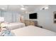 Bedroom with two twin beds, TV, and coastal-themed decor at 4800 S Ocean Blvd. # 1007, North Myrtle Beach, SC 29582