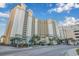 Oceanfront high-rise building with parking and tropical landscaping at 4800 S Ocean Blvd. # 1007, North Myrtle Beach, SC 29582